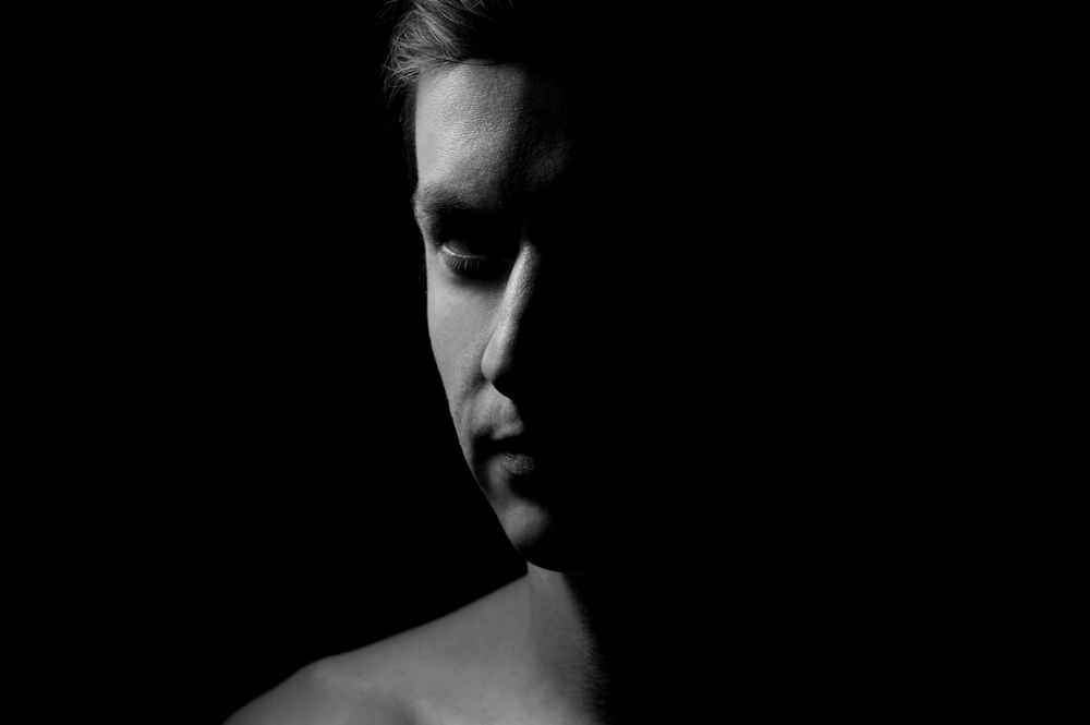 black and white dramatic portrait of a guy