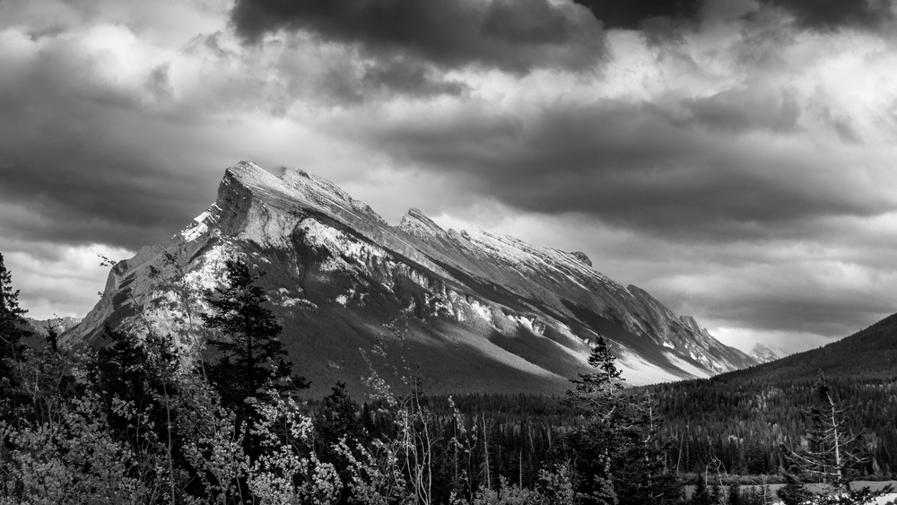 clouds hanging over Mount Rundle in Banff National Park in the Canadian Rocky Mountains BW