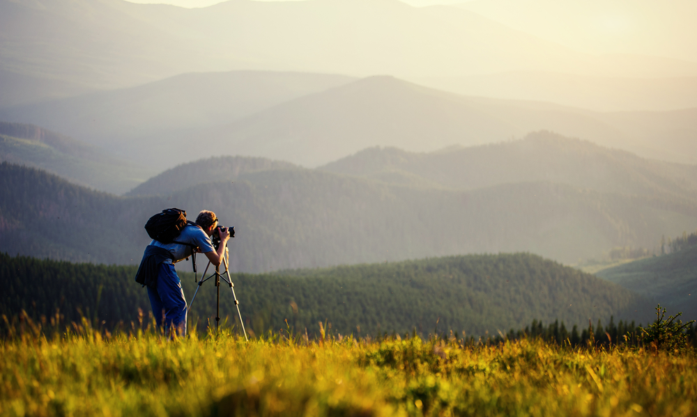 Landscape photographer using a tripod