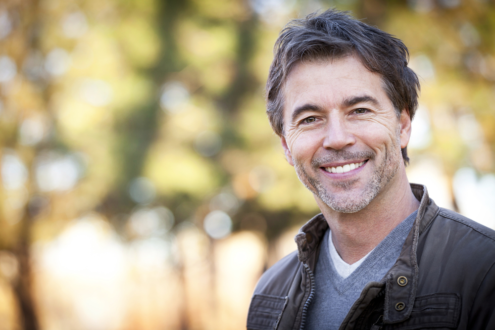 Man smiling with bokeh background