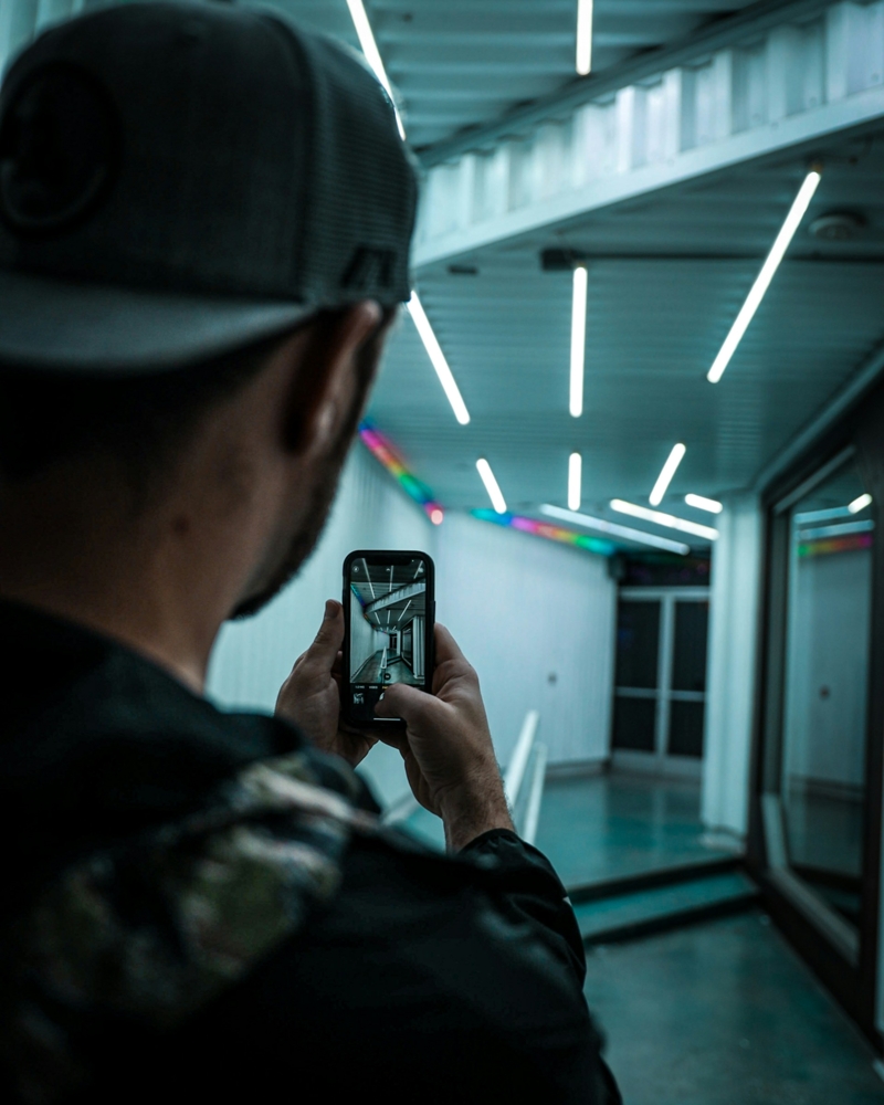 man taking a pictures with his cell phone