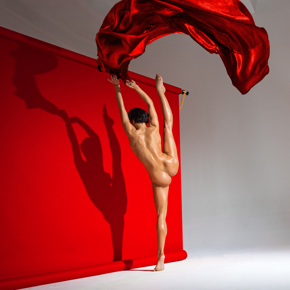 nude Woman Dancing With Red Silk Fabric