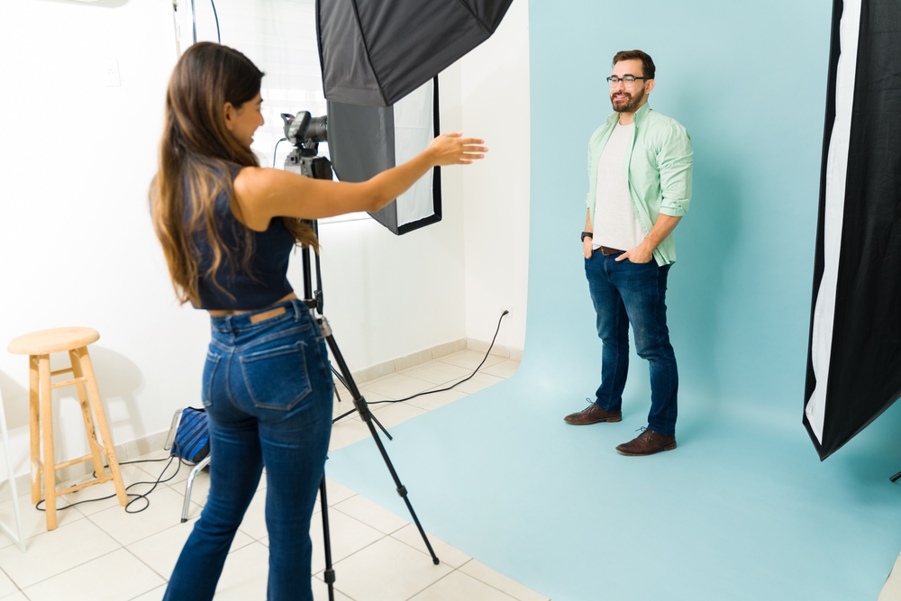 Photographer giving directions in her portrait studio
