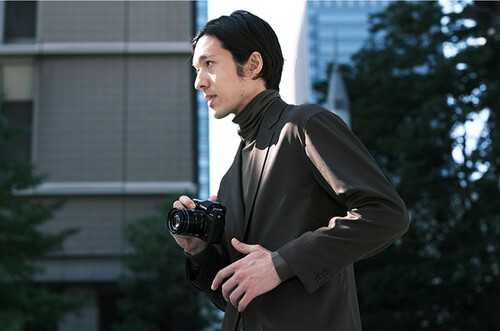 Photographer holding a Fujifilm X-T5