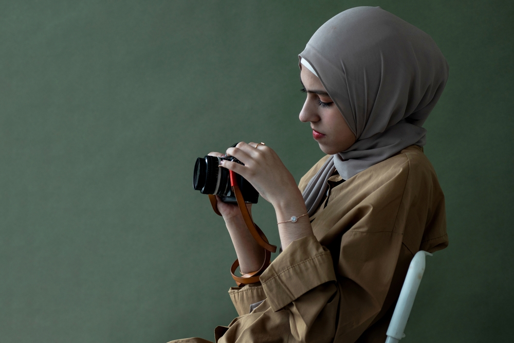 Photographer holding a vintage camera