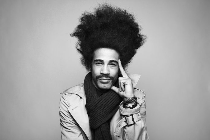 Portrait of a young man with an afro BW