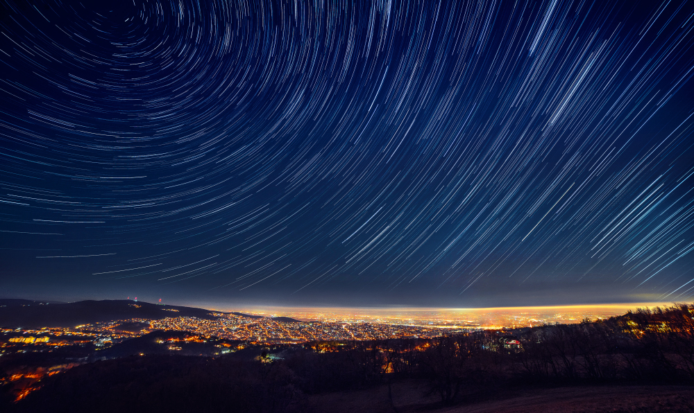 star trails over a city